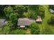 Aerial view of a charming property with lush greenery, a well-maintained home, and a convenient carport at 416 Forrest St, Hillsborough, NC 27278