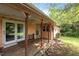 Inviting back porch with wooden deck, offering a relaxing outdoor space at 416 Forrest St, Hillsborough, NC 27278