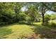 Expansive backyard with lush greenery, providing a private and serene outdoor space at 416 Forrest St, Hillsborough, NC 27278