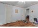 Well-lit bedroom with hardwood floors, offering closet space and easy access to other rooms at 416 Forrest St, Hillsborough, NC 27278