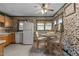 Bright kitchen features a dining nook with natural lighting and patterned wallpaper at 416 Forrest St, Hillsborough, NC 27278