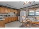 Cozy kitchen with vintage wallpaper and a dining table set for a quaint meal at 416 Forrest St, Hillsborough, NC 27278