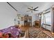 Spacious living room with hardwood flooring, a fireplace, and large windows at 416 Forrest St, Hillsborough, NC 27278