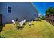Backyard featuring a cozy fire pit area with Adirondack chairs, perfect for outdoor entertaining and relaxation at 42 Juneberry Dr, Chapel Hill, NC 27516