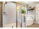 Bright bathroom featuring a glass-enclosed shower, soaking tub, and modern fixtures at 42 Juneberry Dr, Chapel Hill, NC 27516