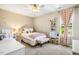 Bright and airy bedroom with decorative wallpaper, a comfortable bed, and a vanity area at 42 Juneberry Dr, Chapel Hill, NC 27516