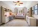Charming bedroom with custom furnishings, a writing desk, and natural light from a large window at 42 Juneberry Dr, Chapel Hill, NC 27516