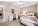 Cozy bedroom with floral wallpaper, comfortable bed, and a white desk area at 42 Juneberry Dr, Chapel Hill, NC 27516