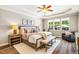 Bright bedroom with a ceiling fan, windows that let in natural light, and a neutral color palette at 42 Juneberry Dr, Chapel Hill, NC 27516