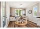 Cozy dining area with built-in cabinets, stylish light fixtures, and ample natural light at 42 Juneberry Dr, Chapel Hill, NC 27516