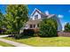 Charming two-story home with a well-manicured front yard and welcoming porch at 42 Juneberry Dr, Chapel Hill, NC 27516