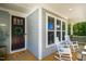 Cozy front porch with rocking chairs, perfect for relaxing and enjoying the neighborhood views at 42 Juneberry Dr, Chapel Hill, NC 27516
