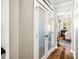 Hallway with a frosted glass door leading to the dining room at 42 Juneberry Dr, Chapel Hill, NC 27516