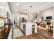 Open-concept kitchen with island seating area that flows seamlessly into the living room at 42 Juneberry Dr, Chapel Hill, NC 27516