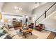 Open-concept living room connects seamlessly to kitchen, featuring a fireplace and stairs at 42 Juneberry Dr, Chapel Hill, NC 27516