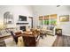 Inviting living room featuring a fireplace, comfortable seating, and large windows at 42 Juneberry Dr, Chapel Hill, NC 27516