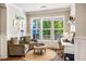 Bright and airy home office featuring hardwood floors, natural light, and cozy seating area at 42 Juneberry Dr, Chapel Hill, NC 27516