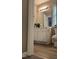 Bathroom featuring a white vanity with neutral walls and wood-look flooring at 433 Turnberry Dr, Mebane, NC 27302