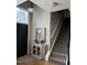 Inviting entryway featuring a black door, stylish console table and hardwood floors at 433 Turnberry Dr, Mebane, NC 27302