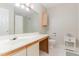 Bathroom with a white sink, vanity, and mirror, complemented by tiled floors at 435 Summerwalk Cir # 435, Chapel Hill, NC 27517