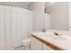 Bathroom with a white shower curtain, toilet, and vanity with a light wood finish at 435 Summerwalk Cir # 435, Chapel Hill, NC 27517
