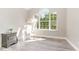 Bedroom featuring a large window, neutral walls, and stylish furnishings with natural light at 435 Summerwalk Cir # 435, Chapel Hill, NC 27517