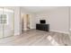 Bedroom featuring a closet with mirrored doors, neutral paint, and wood-look floors at 435 Summerwalk Cir # 435, Chapel Hill, NC 27517