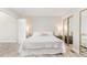 Bright bedroom featuring neutral paint, mirrored closet, and a plush white comforter on the bed at 435 Summerwalk Cir # 435, Chapel Hill, NC 27517