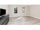 Bedroom featuring two windows and a view of trees, along with wood-look flooring at 435 Summerwalk Cir # 435, Chapel Hill, NC 27517