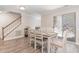 Bright dining area with access to a stairwell, a table, and a sliding door to the outside at 435 Summerwalk Cir # 435, Chapel Hill, NC 27517