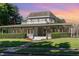 Charming two-story home with a wrap-around porch, inviting curb appeal, and manicured lawn at 435 Summerwalk Cir # 435, Chapel Hill, NC 27517