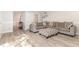 Open-concept living room featuring hard surface floors and a comfortable sofa with patterned pillows at 435 Summerwalk Cir # 435, Chapel Hill, NC 27517