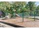 Community playground area with slides, climbing structures, and swings for Gathering fun at 435 Summerwalk Cir # 435, Chapel Hill, NC 27517