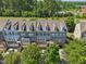 A beautiful view of the townhomes showcasing a well-maintained community with trees at 453 Panorama Park Pl, Cary, NC 27519