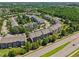 A scenic aerial view of the neighborhood's townhomes surrounded by lush trees and landscaping on a sunny day at 453 Panorama Park Pl, Cary, NC 27519