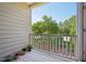 Cozy balcony space with flowers and a view of mature trees and blue sky at 453 Panorama Park Pl, Cary, NC 27519