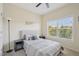 Bedroom features a ceiling fan, a bright window, and carpeted floors at 453 Panorama Park Pl, Cary, NC 27519