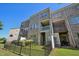 Three story brick and vinyl townhome with a fenced back yard and small back deck at 453 Panorama Park Pl, Cary, NC 27519
