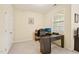 Bright home office featuring a modern desk, chair, and natural light from a window at 453 Panorama Park Pl, Cary, NC 27519