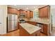 Modern kitchen featuring stainless steel appliances, granite countertops, and custom wood cabinets at 453 Panorama Park Pl, Cary, NC 27519