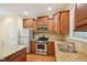Updated kitchen features stainless steel appliances, granite countertops, and wood floors at 453 Panorama Park Pl, Cary, NC 27519