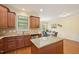 Bright eat-in kitchen with granite countertops, stainless appliances, and access to the dining area at 453 Panorama Park Pl, Cary, NC 27519