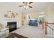 Spacious living room features a fireplace, large TV, and seamless flow to the dining area at 453 Panorama Park Pl, Cary, NC 27519