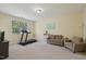 Spacious living room area featuring neutral tones, comfortable seating, and large window at 453 Panorama Park Pl, Cary, NC 27519