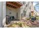 Back patio with seating, a grill, and well-maintained greenery creating an ideal outdoor space at 4533 Pale Moss Dr, Raleigh, NC 27606