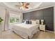Serene main bedroom with tray ceiling, accent wall and natural light at 4533 Pale Moss Dr, Raleigh, NC 27606