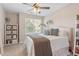 Bedroom with a plush bed, decorative pillows, a bookshelf and a bright window at 4533 Pale Moss Dr, Raleigh, NC 27606