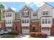 Charming townhome with brick accents, attached garage, and inviting curb appeal at 4533 Pale Moss Dr, Raleigh, NC 27606