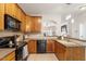 Functional kitchen with ample counter space and black appliances at 4533 Pale Moss Dr, Raleigh, NC 27606