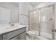 Bathroom with modern vanity, glass shower, and tiled walls at 4716 Crescent Square St # 1314, Raleigh, NC 27616